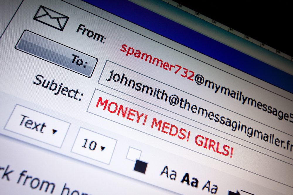 Close up of computer screen with generic spam email subject line of Money, Meds, Girls